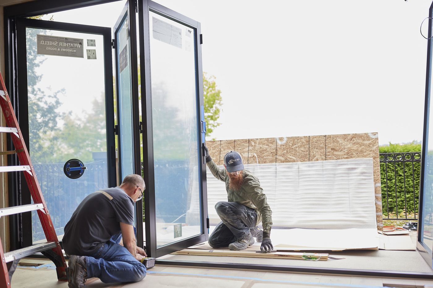 Axiom Home Services crew installing windows
