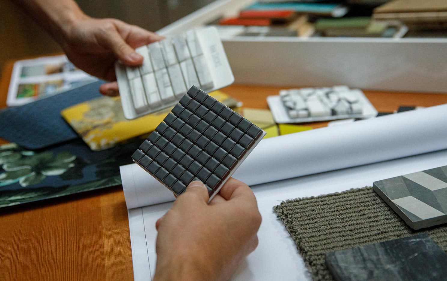 Axiom design team reviewing material samples